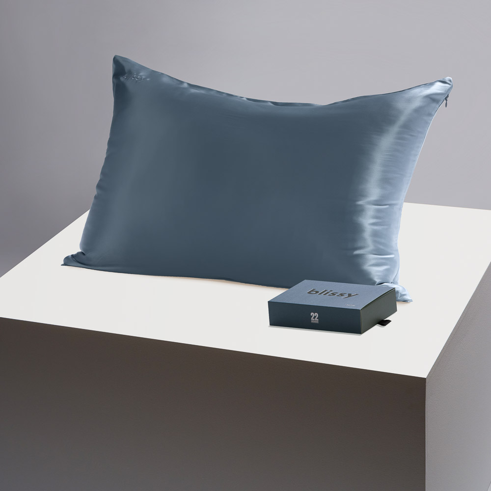 Blissy ash blue pillowcase on a table