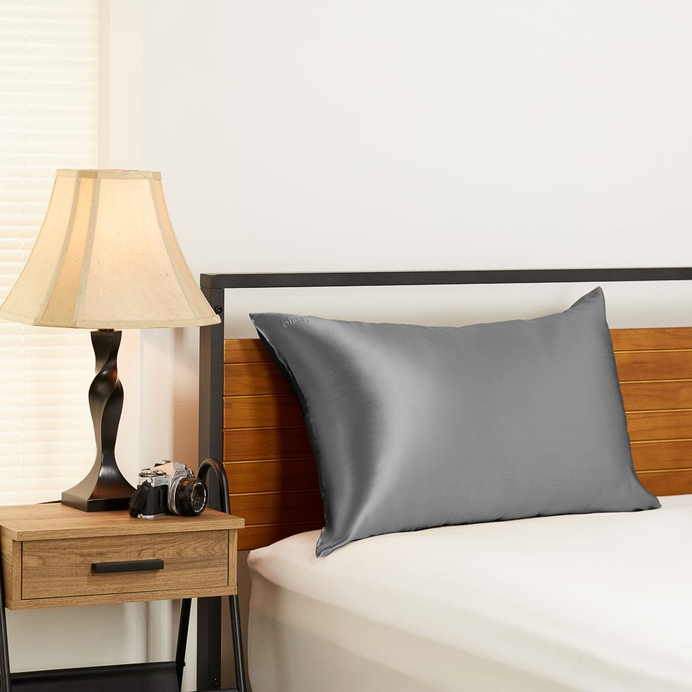 Grey Blissy silk pillowcase in a bedroom