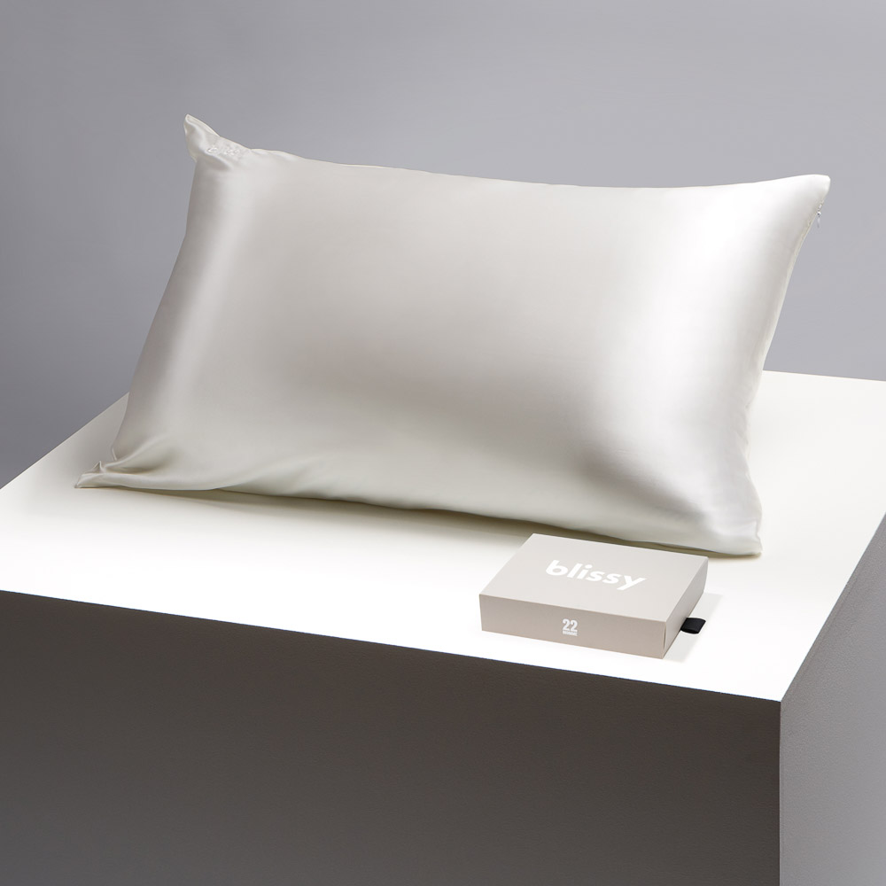 White Blissy silk pillowcase on a table