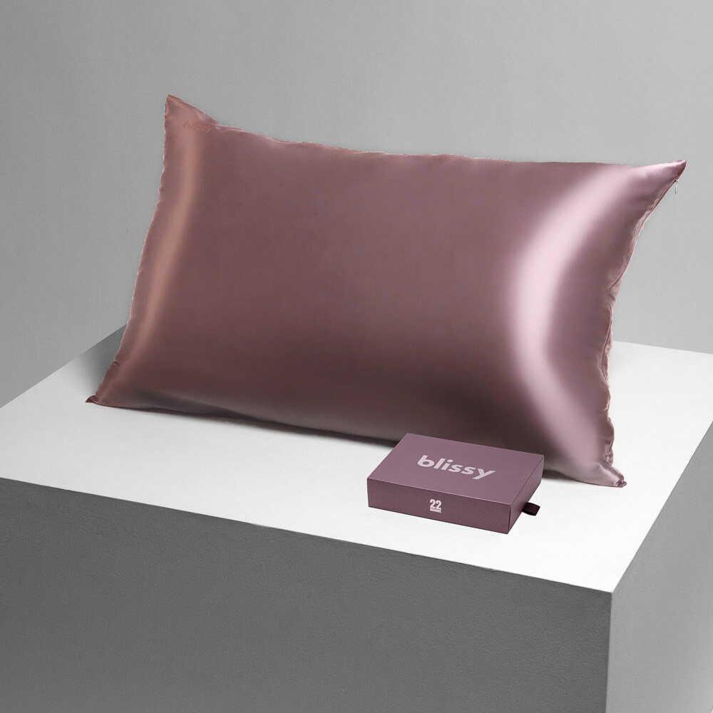 Blissy plum pillowcase on a table