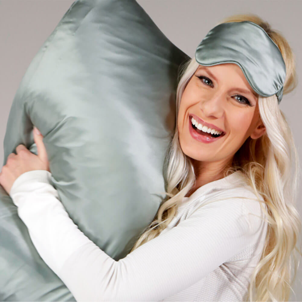 Woman holding a matcha Blissy silk pillowcase
